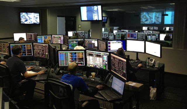 Security control room with multiple monitoring screens